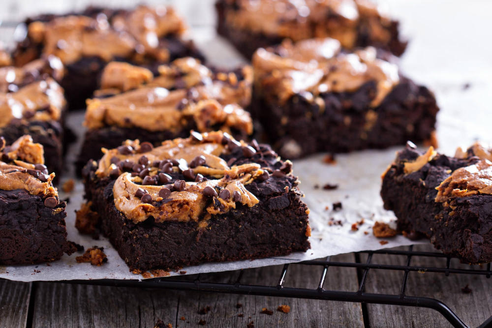 Close-up of freshly baked brookies, featuring a marbled combination of gooey brownie and cookie dough layers