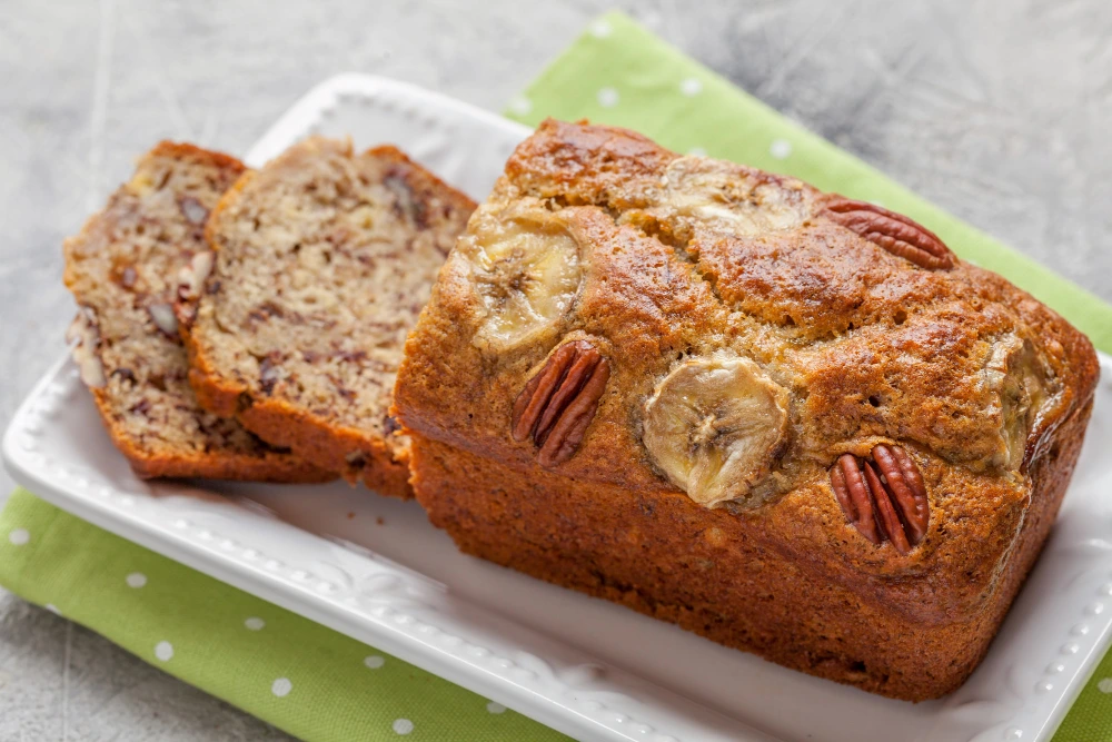 A freshly baked loaf of banana bread made with pancake mix,