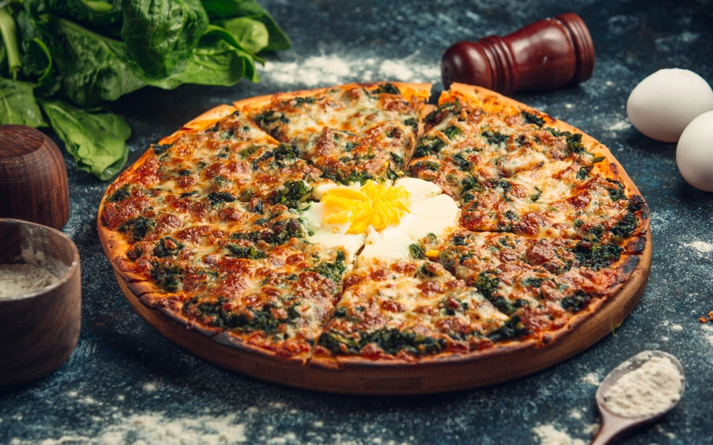 Deliciously baked breakfast tortilla pizza topped with scrambled eggs, cheese, bell peppers, and herbs