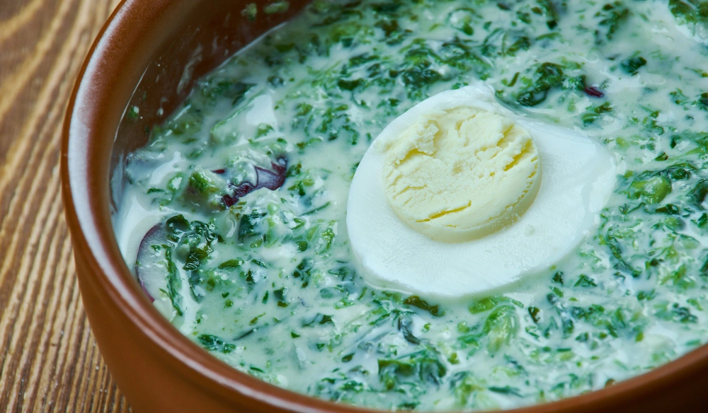 A plate of creamed spinach, showcasing the dish's creamy texture and vibrant green spinach, highlighting the health benefits of this plate.