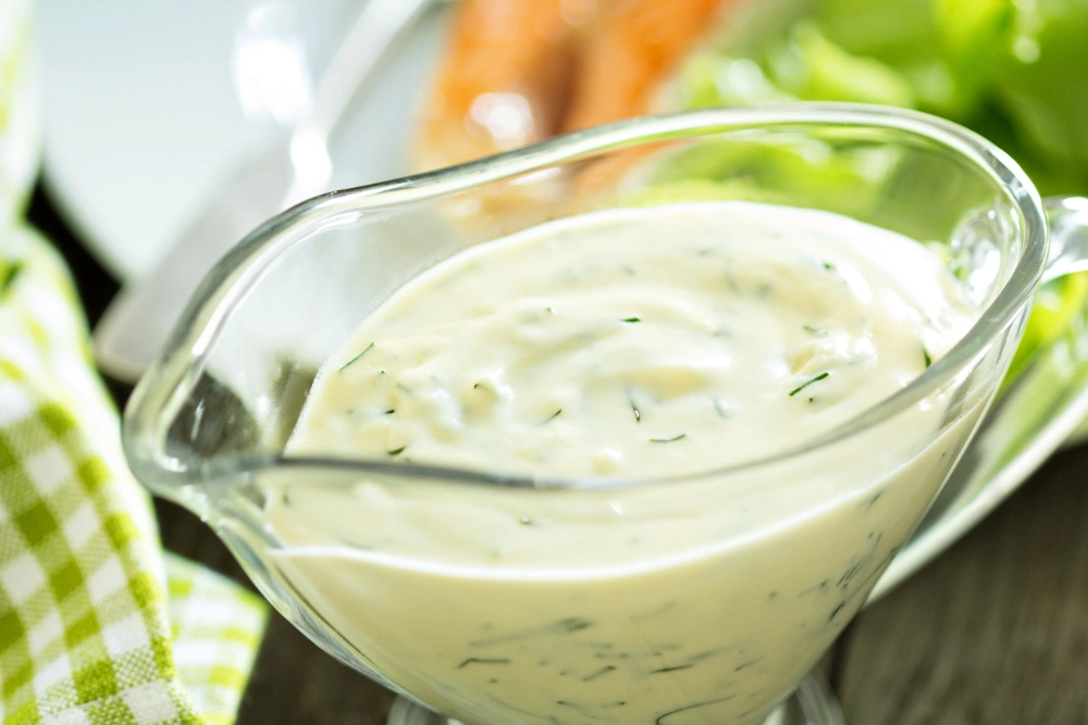 A vibrant bowl of green taco sauce