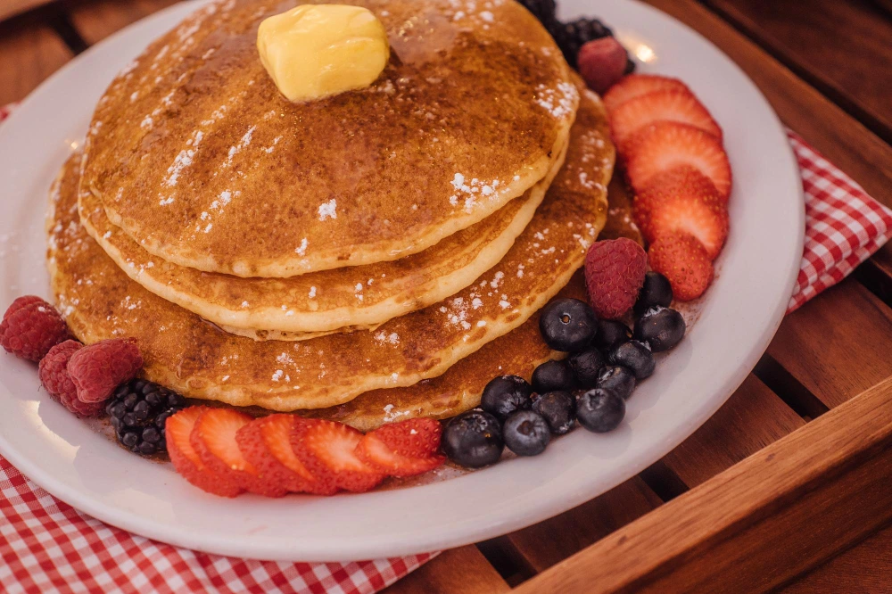 A stack of golden-brown protein pancakes