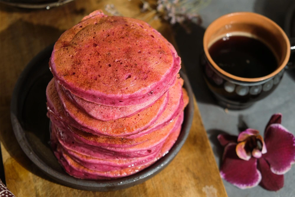 Stack of fluffy taro flavored pancakes