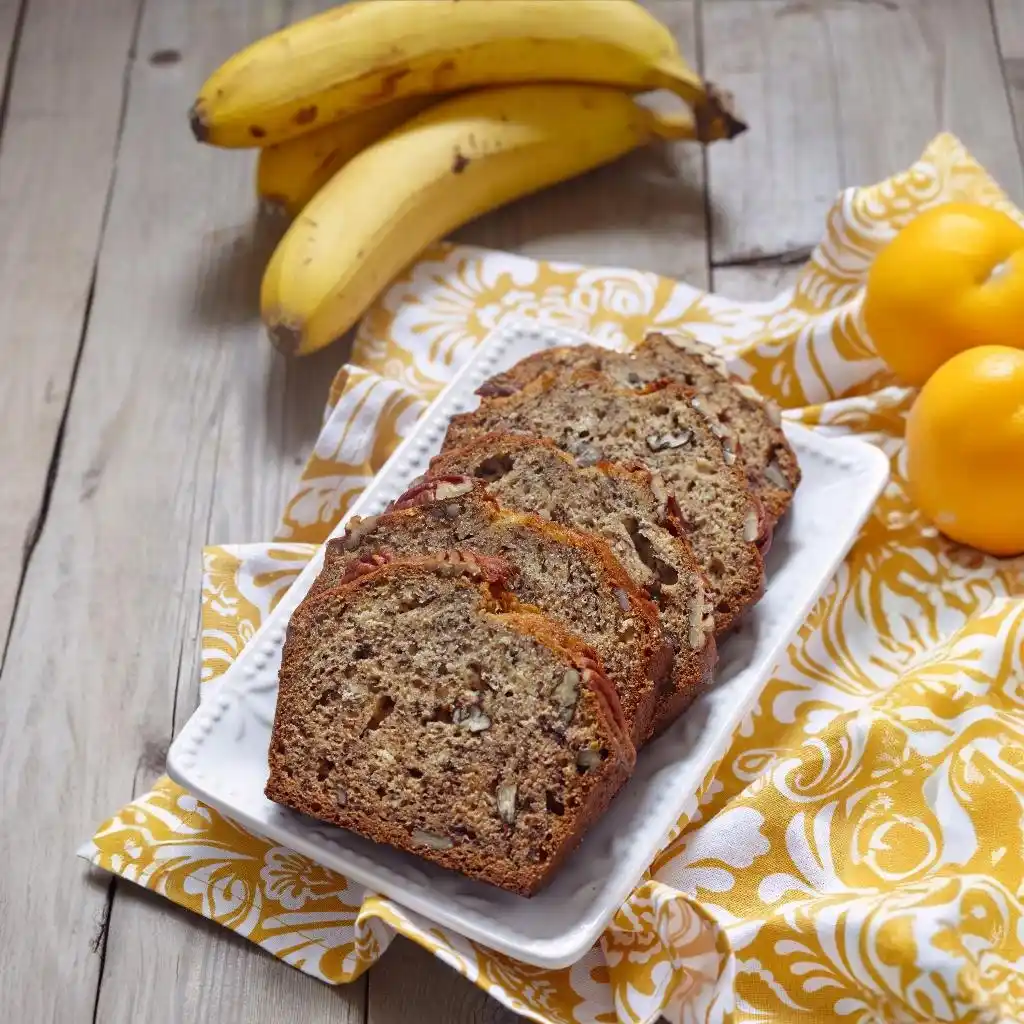 Delicious Banana Bread with Pancake Mix: Easy Recipe & Tips 3 Sliced banana bread with a pecan nuts