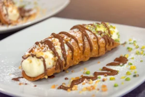 Freshly made cannolis, showing the crispy shell and creamy filling