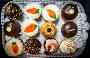 Assorted chocolate cupcakes with various icing styles