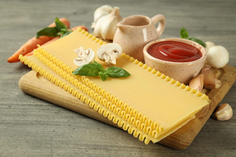 Fresh ingredients for lasagne garlic bread on a counter