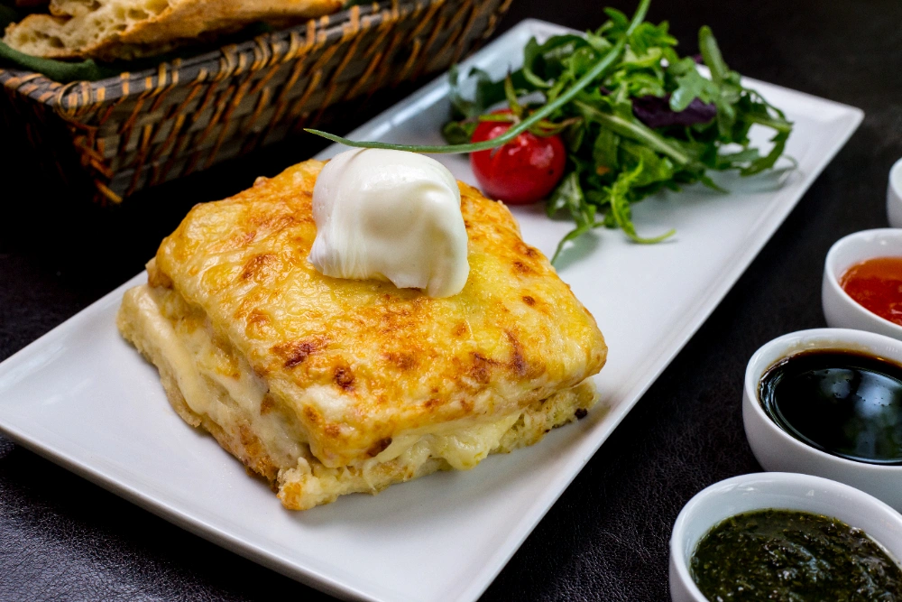 Golden-brown lasagne garlic bread sliced and served