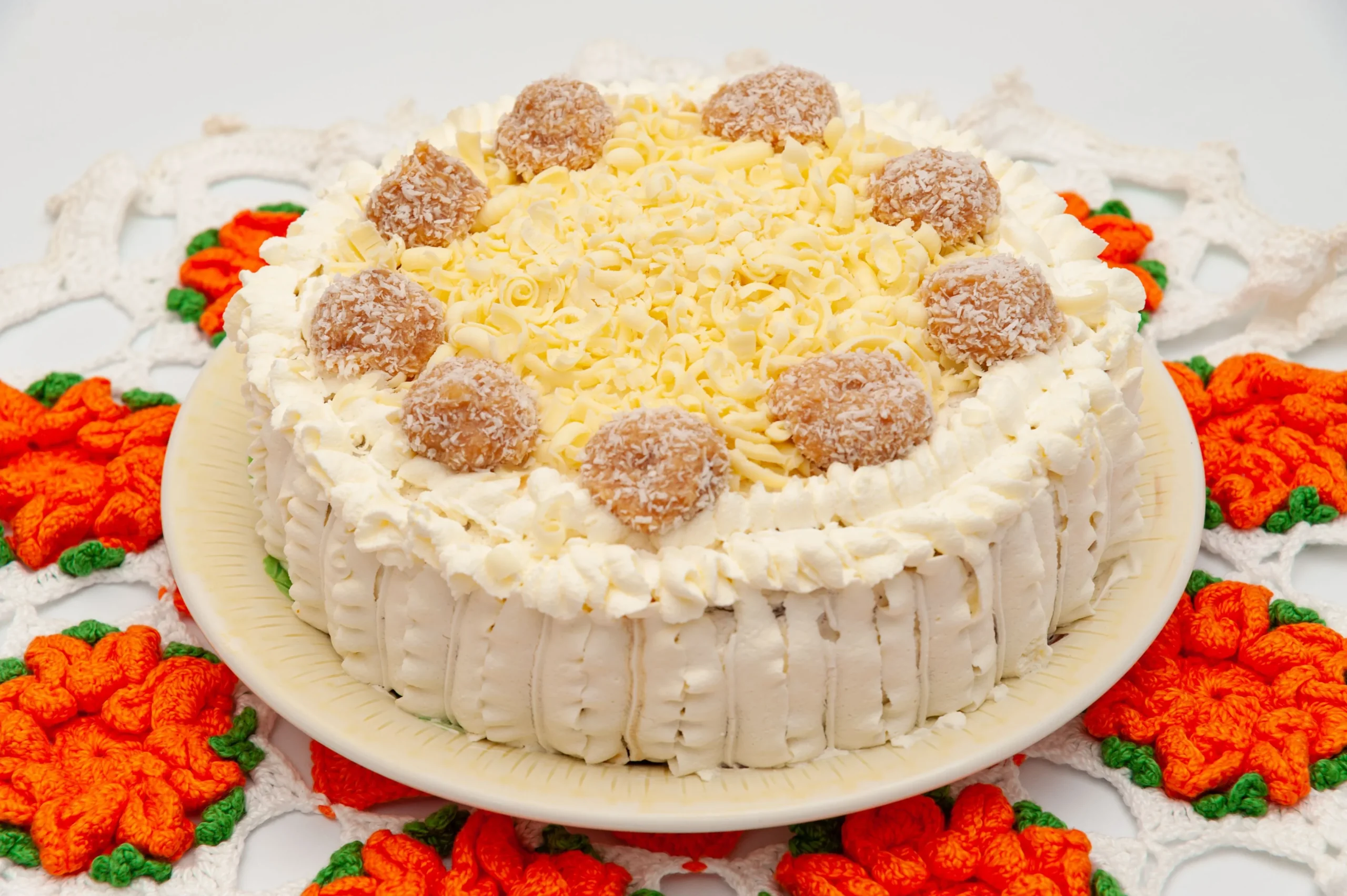 cake with whole madeleine cookies arranged around the plate for decorative flair and added texture.