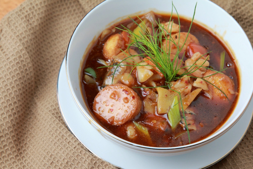 A warm bowl of Italian sausage soup .