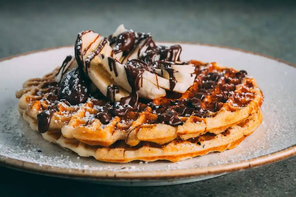 Delicious Bisquick Waffle Recipe: Quick and Easy Breakfast Idea 3 Plate with gourmet waffles with chocolate and banana slices