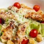 Blackened chicken Caesar salad served in a bowl