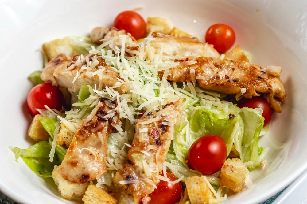 Blackened chicken Caesar salad served in a bowl