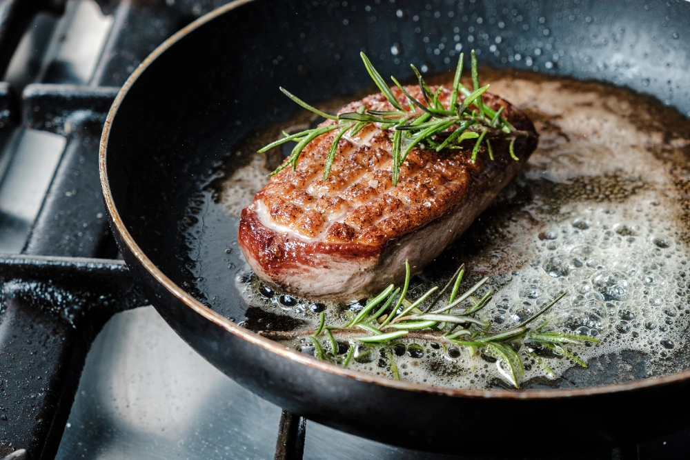 The Ultimate Steak Caesar Salad Recipe for a Delicious Meal 3 Grilled steak slices on skillet for Caesar salad
